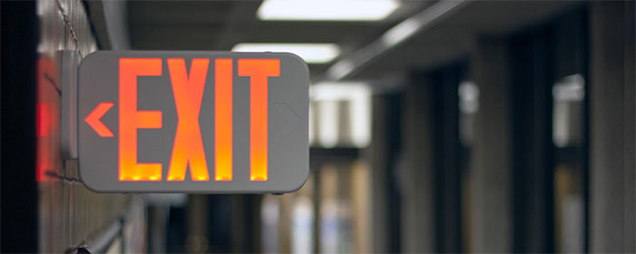 exit sign in a school hallway